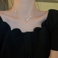 Close-up of French style butterfly pearl necklace on model's collarbone - Silver (Pearl Butterfly)
