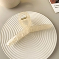 Minimalist large cream twist claw clip for women on white ceramic display tray - Jelly Mermaid-15cm (Extended)