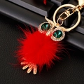 Detail of red pompom owl keychain with crystal eyes and gold-plated metal hardware - Plush Owl Red