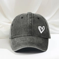 Adjustable washed charcoal baseball cap featuring an embroidered white heart pattern - Black