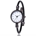 Macro shot of silver-tone cable bangle watch with round dial and quartz movement - Black White Dial Linear Scales