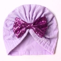 Detail of light purple baby turban hat with a large deep purple sequin bow decoration - Purple