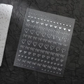Détail d'autocollants 3D argentés pour ongles avec motifs de cœurs et de nœuds - CO-546 / Marquage à chaud