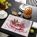 Pink Christmas table mat featuring a festive sleigh design on a dark wood grain table - CD57-15