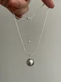 Close-up of a silver snake chain necklace featuring a grey pearl pendant with metallic luster - Silver (Full Sterling Silver Edition)