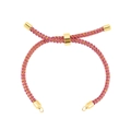 Pink and gold braided cord bracelet featuring an adjustable round slider and loop ends - Bracelet: 46