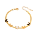 Bracelet chaîne serpent dorée avec cinq breloques papillon noires et blanches et extension - Bracelet Papillon