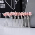 Detail of handmade silver hair comb with rose quartz crystals wire-wrapped on metal teeth - Pink Opal + 20-Tooth Silver Comb