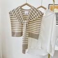 Knitted striped shawl wrap in beige and white stripes, styled with a front knot over a shirt - Khaki Striped