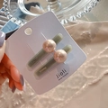 Close-up of elegant pearl hair clips with resin base and FRANCE engraving on card - Pearl Style White Pink Pair