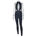 Detailed view of black halter cutout jumpsuit with mesh panels and slim fit design - S / Black