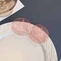 Detail of pink translucent square acrylic earrings with ripple texture on white ceramic plate - Peach Pink