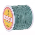 Cyan 72 jade thread for jewelry braiding on a white plastic spool roll - Autumn Green