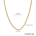 Detalle de collar de bolas de acero de titanio de 46cm con cuentas doradas - Cadena de Cuentas