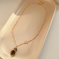 Detail of tiger eye gourd pendant on a gold necklace with adjustable extension chain - Gold-Coffee (Necklace)