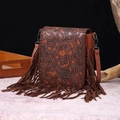 Vintage brown leather crossbody bag featuring floral embossing and long side tassels - Red Brown