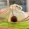 Macro view of a mini wooden baseball bat and leather ball keychain with red stitching - 4.5CM Short Bat/Coffee Ball (No Large Ring)