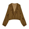 Detailed view of the ruffle trim, V-neckline, and tie-up front of this brown long sleeve top - S / Dark Khaki