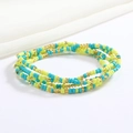 Macro detail of multi-layer beaded waist chain in blue, neon green, and gold beads - Lake Blue Green Gold