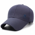 Navy blue baseball cap with shield embroidery and XIN SHENG logo from 45-degree angle - Adjustable / Dark Gray