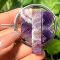 Close-up of handmade geometric hair clip featuring raw purple amethyst crystals - Silver Circle Amethyst Slice