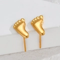 Elegant gold foot-shaped stainless steel stud earrings on a white marble background - Baby Feet / Gold