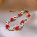 Beaded flower bracelet with red, white and green beads on a beige silk background - 5# Flower Seed Bead Pearl Bracelet