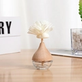 Aromatherapy reed diffuser with glass bottle, wooden cap and a white flower diffuser - Water Drop Flower Empty Bottle