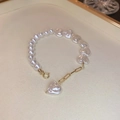 Irregular heart pearl bracelet with golden magnetic clasp on a textured tray - Pearl Heart Style (5#) / White (Gold Heart Clasp)