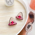 Cute pink and beige acrylic crab earrings set on a minimal wooden plate display - Hermit Crab (Pair)