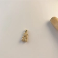 Gold-plated bear pendant with micro-pave cubic zirconia on a warm minimalist background - Golden Bear Micro-set Zirconia
