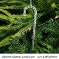 Set of six clear 138mm acrylic Christmas candy cane ornaments on a festive tree branch - 138mm Candy Cane