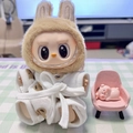 Close-up of Labubu doll wearing a white patterned bathrobe with a pink pig figurine - Small Teddy Bear Pajamas (single Piece) / First And Second Generation Keychains Are Compatible With La Cloth Dolls. Dolls Not Included.