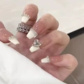 French tip press-on nails with pink base, tiny crystals and a large heart-shaped rhinestone - Nude Pink French Heart Rhinestone (N5119)