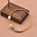 Gold wire woven bracelet with white freshwater pearls in various sizes for women - Gold Simple Seed Pearl Style