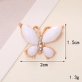 Macro shot of a butterfly charm showing dimensions 2cm by 1.5cm with rhinestone details - D713 Accessory Small Butterfly