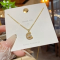 Collana in acciaio al titanio dorato con pendente a luna e stella con zirconi - Stile pendente combinato stella e luna (X642) / Oro