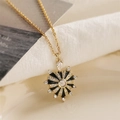 Gold plated heart pendant necklace with black enamel and sparkling zircon stones - Black Sunburst Style