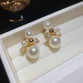 Macro shot of 14k gold plated pearl and zircon earrings in a striped jewelry box - One Pair / White (Real Gold Plated/Silver Pin)