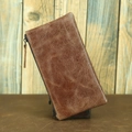 Close-up of vintage brown crazy horse leather wallet texture and stitching detail - Soft Leather Ice Crackle