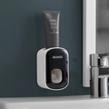 Wall-mounted automatic toothpaste dispenser in sleek black and white minimalist style - Toothpaste Dispenser - Black