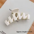 Matte white hollow geometric hair claw clip in 11.5cm length on wooden desk - Matte N-Shape White-11.5cm