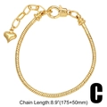 Detailed view of gold snake chain bracelet with heart pendant and 8.9 inch size label - Gold-Bracelet C