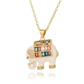 Detailed close-up of a gold elephant necklace with colorful zircon stones on white background - White