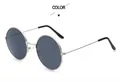 Detail view of round silver metal frame sunglasses with gray lenses and black temple tips - Silver Frame Grey Lens