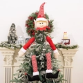 Dettaglio del puntale per albero di Natale con elfo e cappello a righe rosse - Elfo
