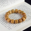 Detailed macro of green sandalwood prayer beads showing natural wood grain and texture - Green Sandalwood Classical Beads / 15mm*15 Beads / Yellow-Green