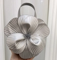 Detail of silver petal-shaped tote bag with 3D floral texture and metallic finish - Silver