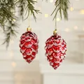 Red pinecone Christmas ornament with white snow finish and gold hook on a pine branch - Pine Cone (Set of 2)