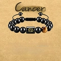 Beaded Cancer zodiac bracelet with tiger eye and black obsidian on vintage background - Cancer